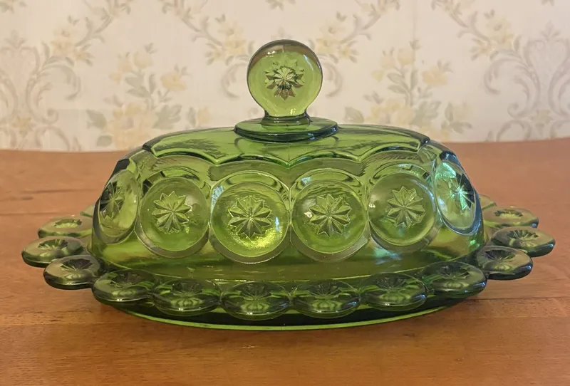 Pressed Green Glass Covered Butter Dish in Moon and Star Pattern from auction in Shelbyville, Kentucky