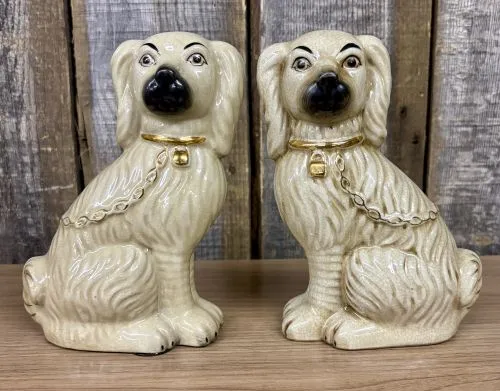 A Pair of Carlton Varney Ceramic Staffordshire Spaniel Figurines from auction in Shelbyville, Kentucky