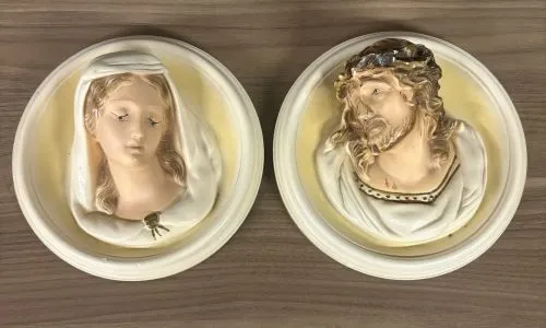 A Pair of Vintage Chalkware Religious Wall Plaques Depicting Jesus and the Virgin Mary from auction in Shelbyville, Kentucky