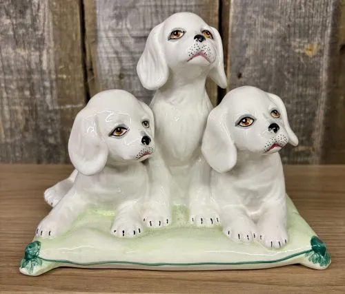 A Trio of Italian Majolica Porcelain Puppies on a Cushion from auction in Shelbyville, Kentucky
