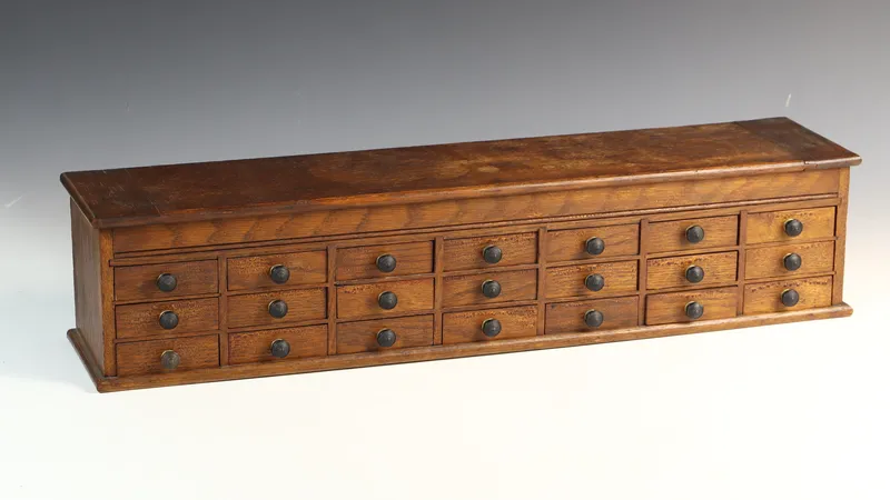 Antique Oak 18-Drawer Watchmaker's Cabinet with Lift-Top from auction in Morgantown, Pennsylvania