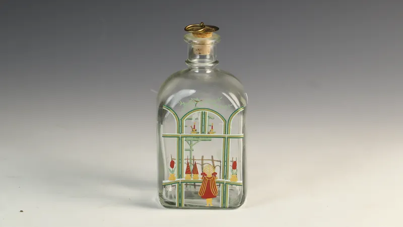Holmegaard 1987 Christmas Glass Decanter with Brass Ring Cork Stopper from auction in Morgantown, Pennsylvania
