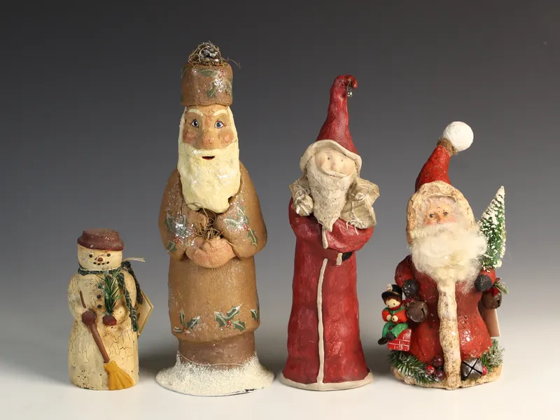 A Group of Four Contemporary Folk Art Holiday Figurines Including Krisnick from auction in Morgantown, Pennsylvania