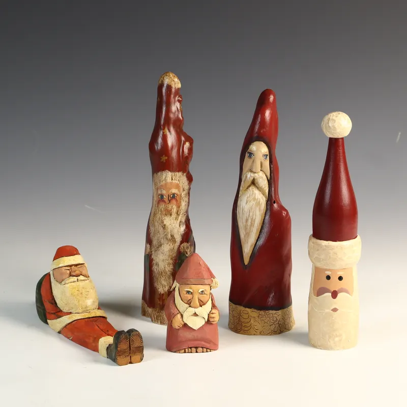 Five Hand-Carved and Hand-Painted Folk Art Wood Santa Claus and Saint Nicholas Figurines from auction in Morgantown, Pennsylvania