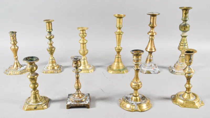 Collection of 10 Antique Turned Brass Candlesticks from auction in Lincoln Park, New Jersey