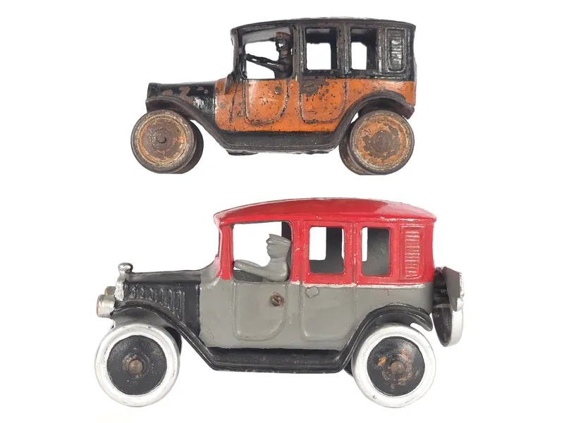 (2) Freidag Cast Iron Taxi in Orange and Second Red Top Taxi 8" from auction in Myakka City, Florida