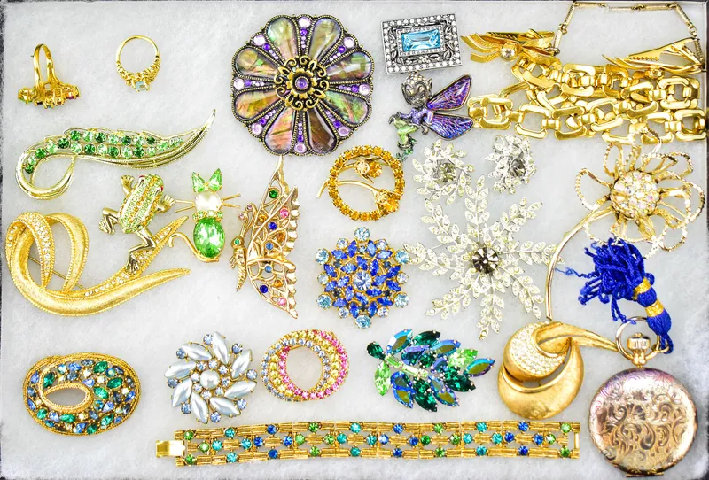 RHINESTONE COSTUME JEWLERY ASSORTMENT; ESTEE LAUDER, FLORENZA, JOAN RIVERS, ETC. from auction in Aurora, Oregon