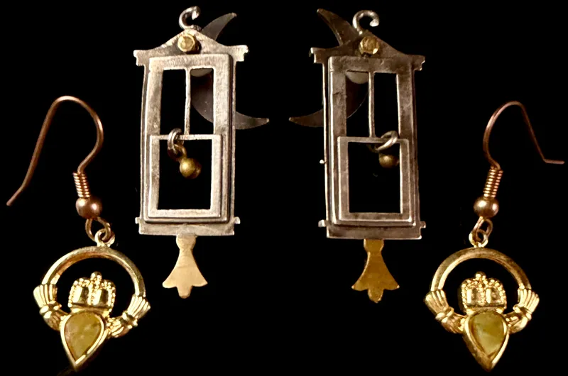 A Pair of Guillotine Motif Mixed-Metal Earrings and a Pair of Claddagh Motif Drop Earrings from auction in Campbell, New York