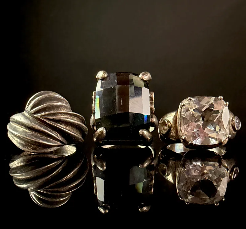 A Trio of Sterling Silver Cocktail Rings including a TOUS Swirl Dome Ring from auction in Campbell, New York