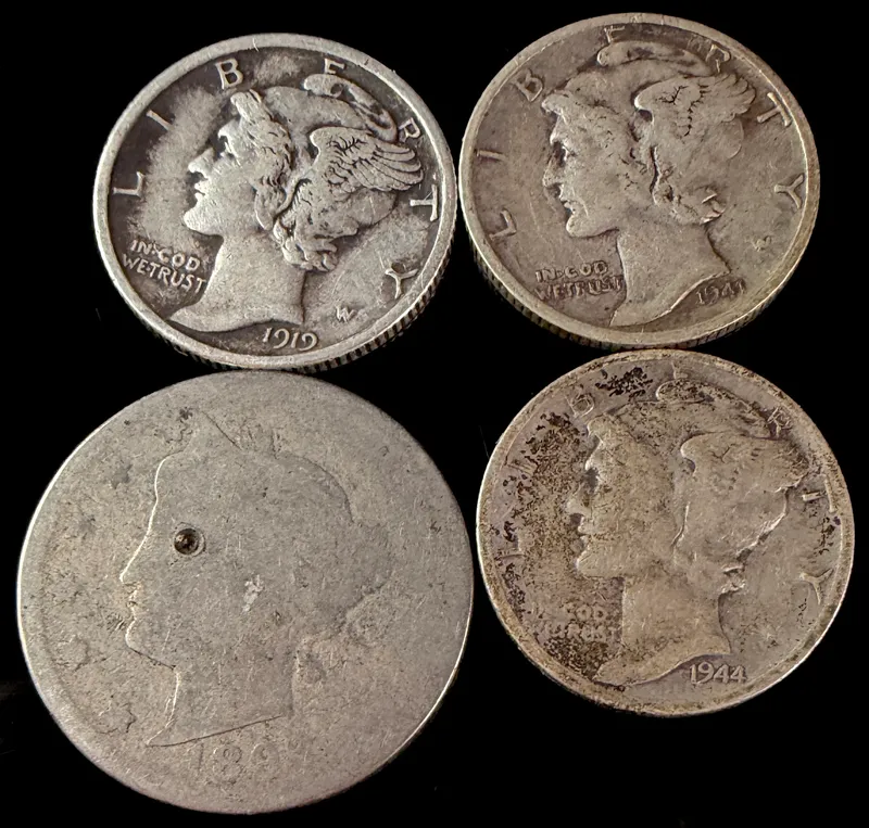 A Collection of Four US Coins Including Mercury Silver Dimes and an 1894 Liberty Head Nickel from auction in Campbell, New York