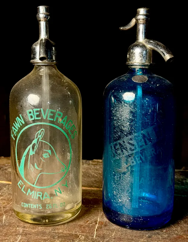 Two Vintage New York Glass Seltzer Siphon Bottles including Fawn Beverages and Jensen Beverages from auction in Campbell, New York