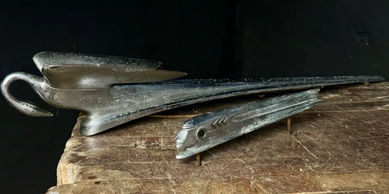 Two Vintage Packard Swan and Pontiac Chieftain Hood Ornaments from auction in Campbell, New York