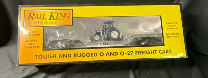 RailKing by MTH Electric Trains Item No 30-7611 Construction Flatcar with Ertl Tractor from auction in Campbell, New York