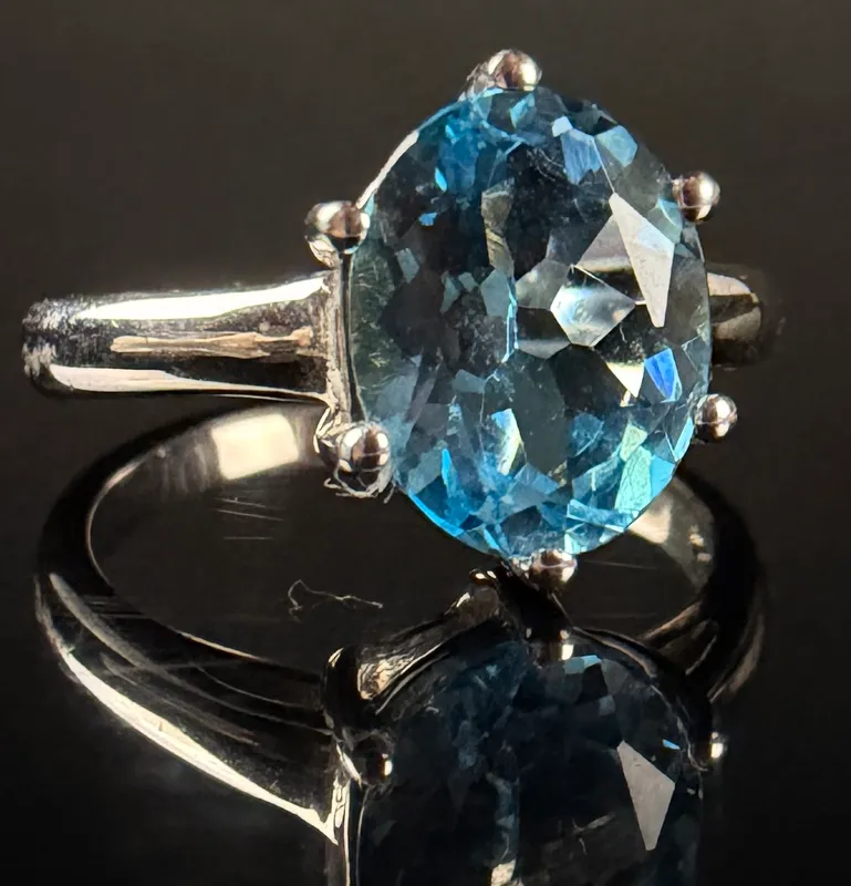 Sterling Silver and Oval Cut Light Blue Gemstone Solitaire Ring from auction in Campbell, New York