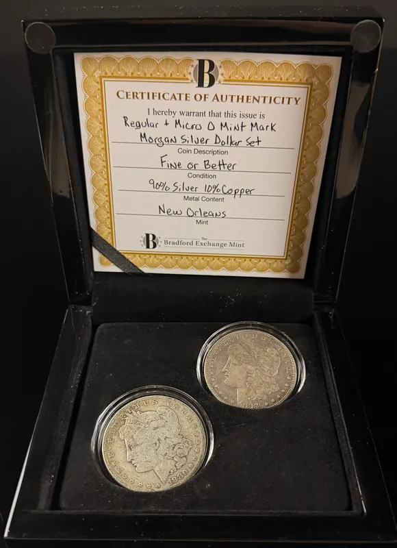 A Pair of US Morgan Silver Dollars, 1880-O and 1889-O Micro O Variety from auction in Campbell, New York