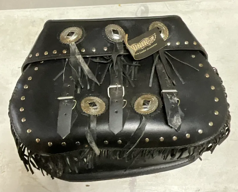Unik International Fringed Black Leather Motorcycle Saddlebag from auction in Campbell, New York