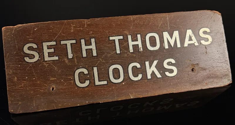Vintage Seth Thomas Clocks Wooden Advertising Counter Sign from auction in Campbell, New York