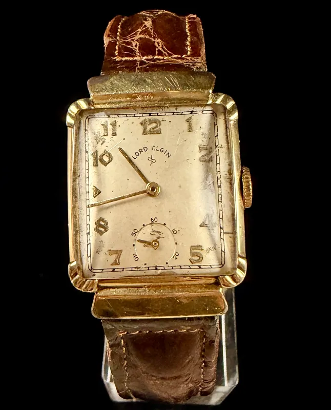 Lord Elgin 14K Gold Filled Rectangular Tank Watch with Hooded Lugs and Omega Band from auction in Campbell, New York