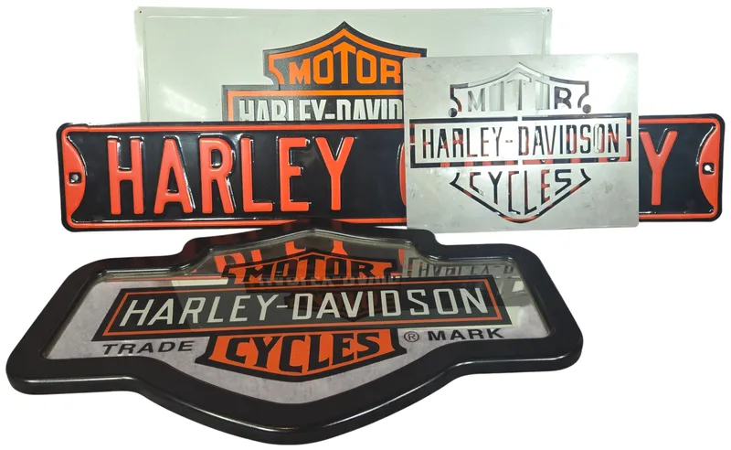 Four Harley-Davidson Branded Decorative Metal Signs and Bar and Shield Mirror from auction in Lancaster, Ohio