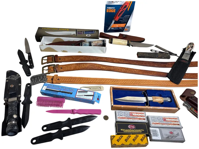Assorted Hunting and Folding Knives with Tooled Leather Belts and Collectible Case Packaging from auction in Lancaster, Ohio