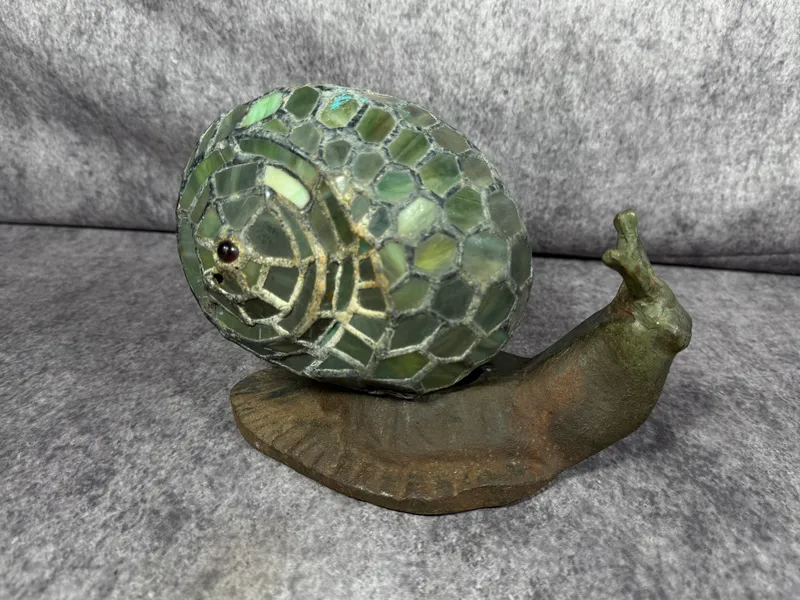 Land Snail Tiffany Style Stained Glass Accent Table Lamp from auction in Lancaster, Ohio