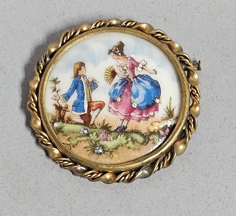 Limoges Porcelain Hand Painted Couple Brooch from auction in Okemos, Michigan